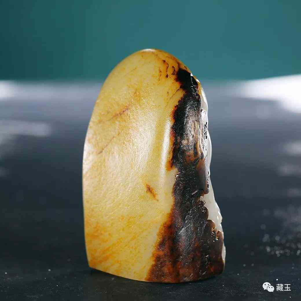 黑皮和田玉籽料原石(黑皮和田玉籽料原石鑲嵌吊墜)